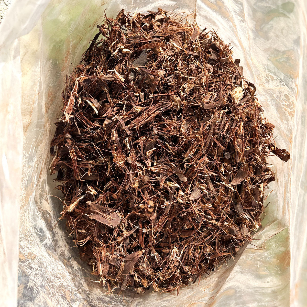 Shredded Pine Cone Mulch in a bag